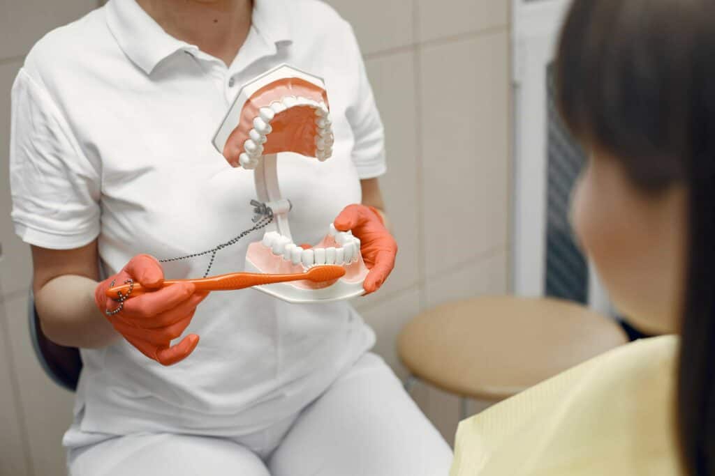 showing how to brush and floss teeth